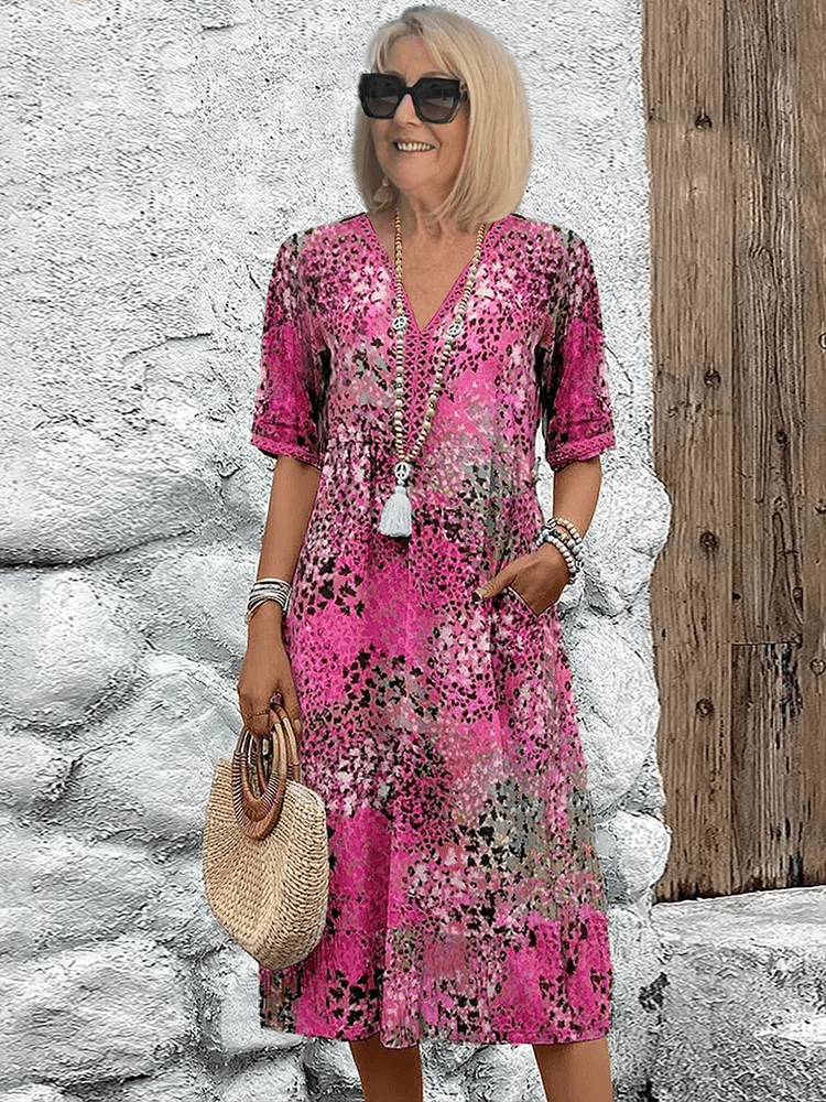 Midi dress featuring an abstract print and lace V-neck, designed for a soft, breathable casual style, complete with convenient side pockets. 0